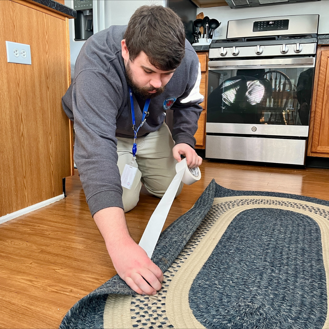 daniel taping down carpet